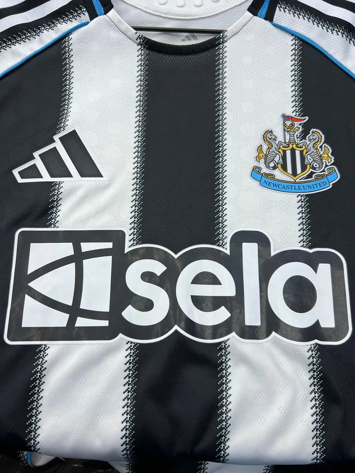 Adidas Newcastle United 2025/26 Authentic Home Jersey — chest sponsor close-up